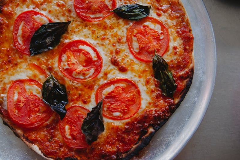 Punch Classic Margherita punch pizza with fresh basil and mozzarella
